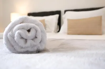a towel animal sitting on top of a bed at The Seacroft in Southport
