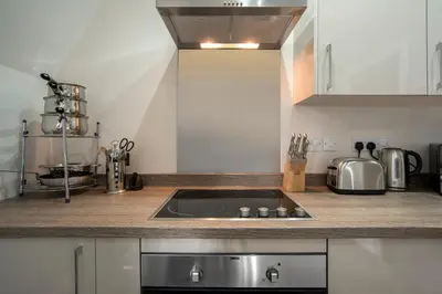 a kitchen with a sink and a counter top at The Castle Collection - 42 Castle Street in Liverpool
