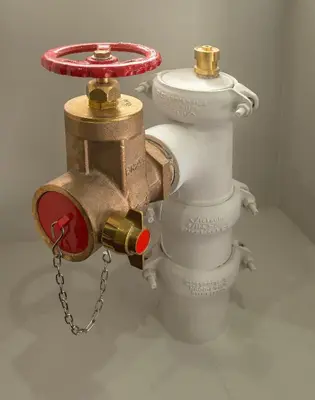 a fire hydrant with a red valve on it at The Castle Collection - 42 Castle Street in Liverpool