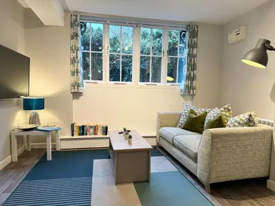 a living room with a couch and a table at Warehouse Apartments 1Bed Sleeps 2 Pets Welcome in Ulverston