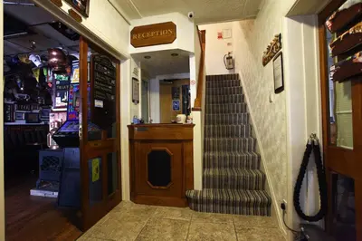 a store entrance with a staircase in a store at Clifton Court Hotel in Blackpool