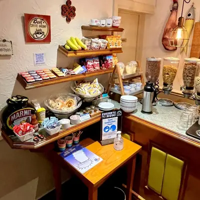 a kitchen with a counter with food on a table at Clifton Court Hotel in Blackpool