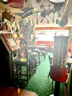 a dining room with a table and chairs in a restaurant at Clifton Court Hotel in Blackpool