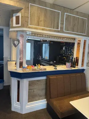 a kitchen with a island with a counter top at The Shores Hotel, Central Blackpool in Blackpool