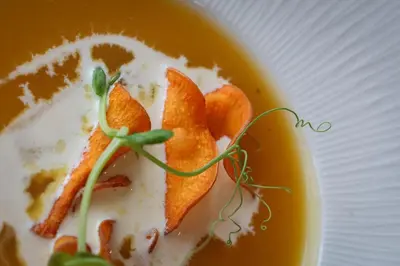 a bowl of soup with food on a plate at Hotel Sheraton in Blackpool