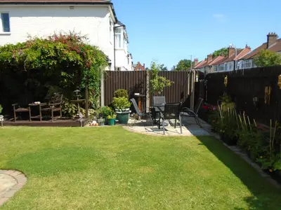 a backyard with a fence and a table and chairs at TEA in Liverpool - Private - Quiet - Ground Floor - En-suite - Walk-in-shower in Liverpool