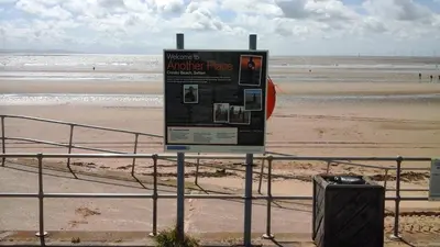 a sign in front of a beach with the ocean at TEA in Liverpool - Private - Quiet - Ground Floor - En-suite - Walk-in-shower in Liverpool