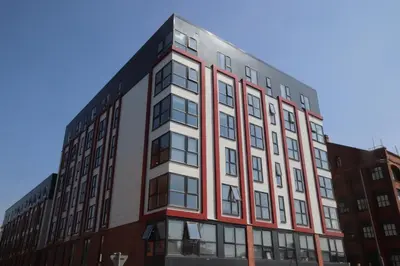 an apartment building on the corner of a street at Fox Street Delight in Liverpool
