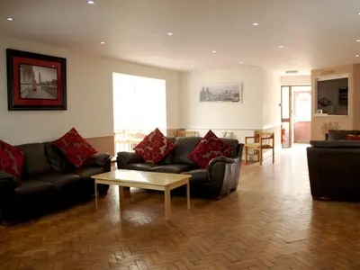 a living room with couches and a coffee table at The Liver View in Birkenhead
