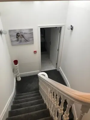 a staircase in a house with a stair case at 88 Anfield Road in Liverpool