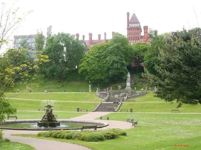 a fountain in a park in front of a building at Fishergate ApartHotel 2 - City Centre Location in Preston