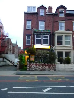 a large brick building on the side of a street at K.k's North Station Self catering holiday apartments in Blackpool