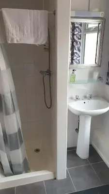 a bathroom with a sink and a shower at HOTEL242 in Blackpool