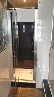 a shower with a glass door in a bathroom at HOTEL242 in Blackpool