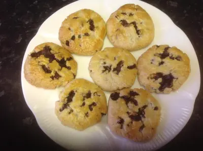 a plate of cookies with chocolate chips on it at The Bowden Lodge Complimentary afternoon tea 15th Mar '26 Terms and Conditions apply in Southport
