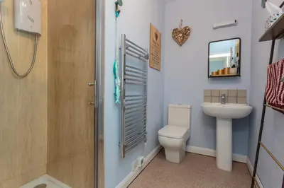 a bathroom with a toilet and a sink at Beach Hideaway in Lytham St Annes