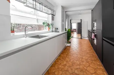 a kitchen with a sink and a counter top at Stanley House - Air Host & Stay - 4 Bedroom in Liverpool