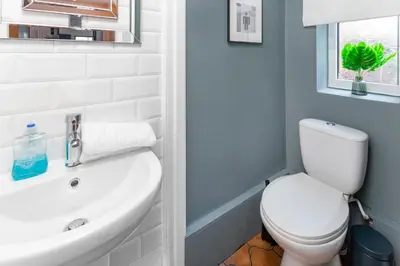a bathroom with a white toilet and a sink at Stanley House - Air Host & Stay - 4 Bedroom in Liverpool