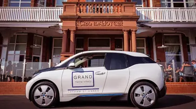 a small white car with a grand insurance sign on it at The Grand Hotel in Lytham St Annes