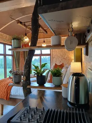 a room with a keyboard and plants on a desk at Little Oakhurst in Clitheroe
