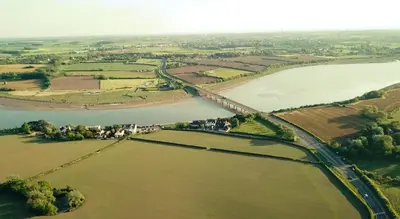 an aerial view of a bridge over a river at Willow Lodge Hambleton in Poulton le Fylde