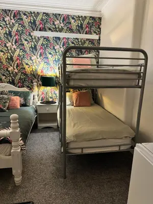 a bunk bed room with two bunk beds in it at On The Beach Apartments in Blackpool