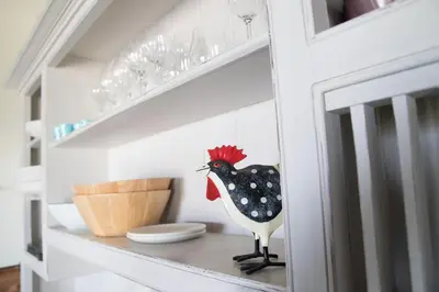a wooden chicken is sitting on a shelf in a kitchen at The Chicken Shed at Knowle Top in Clitheroe