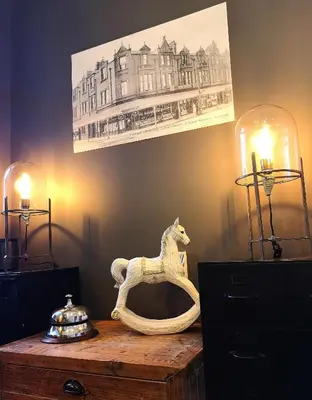 a table with a white horse statue on top of it at Mode Hotel Lytham in Lytham St Annes