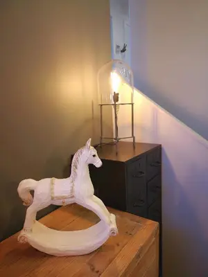 a wooden toy horse on a table with a lamp at Mode Hotel Lytham in Lytham St Annes