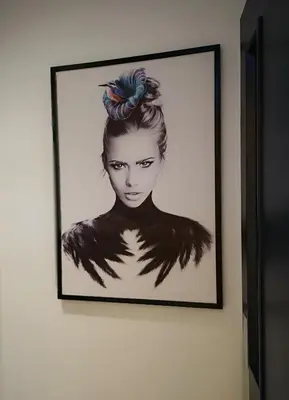 a drawing of a woman with araid on a wall at Mode Hotel Lytham in Lytham St Annes