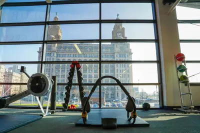 a gym with a view of a large window at Crowne Plaza Liverpool City Centre by IHG in Liverpool