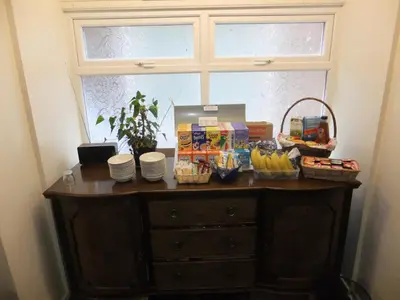a table with food on it in front of a window at Charnley Gold in Blackpool