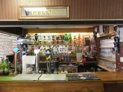 a bar with a lot of bottles of alcohol at Charnley Gold in Blackpool
