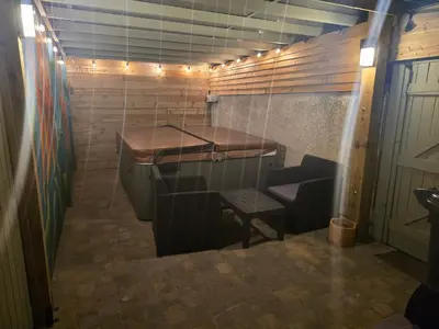 a room with a table and a bench in a room at Eden Rose Cottage hot-tub jacuzzi morecambe-bay in Morecambe