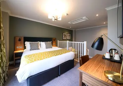 a bedroom with a large bed and a desk at All Bar One by Innkeeper's Collection in Liverpool