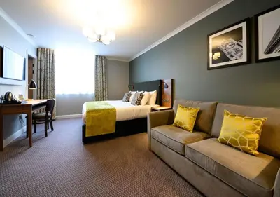 a hotel room with a bed and a couch at All Bar One by Innkeeper's Collection in Liverpool