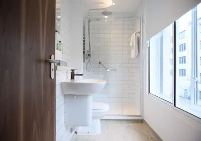 a white bathroom with a sink and a toilet at All Bar One by Innkeeper's Collection in Liverpool