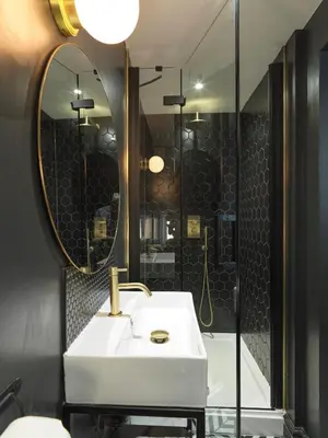 a bathroom with a white sink and a mirror at Hy Lytham St Anne's in Lytham St Annes