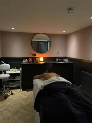 a hospital room with a bed and a mirror at Hy Lytham St Anne's in Lytham St Annes
