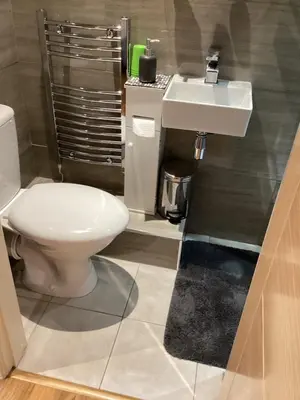 a bathroom with a toilet and a sink at The Anfield Apartment in Liverpool