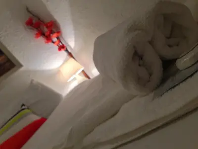 a stack of white towels sitting on a table at Wilsons Hotel - Blackpool Tower View in Blackpool