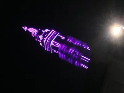 a purple object is lit up in the dark at Wilsons Hotel - Blackpool Tower View in Blackpool