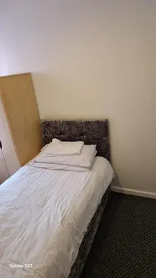 a bed in a corner of a room at Chilton Hotel in Blackpool