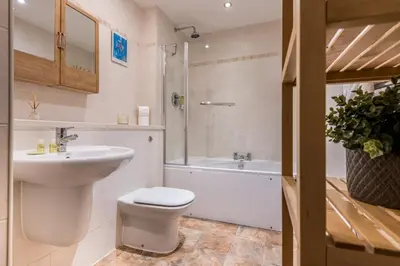 a bathroom with a sink and a toilet and a shower at Host & Stay - York Place Apt in Liverpool