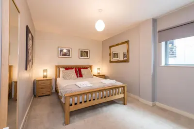 a bedroom with a bed and a window at Host & Stay - York Place Apt in Liverpool