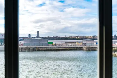 a view of a body of water from a window at Host & Stay - Waterfront View in Liverpool