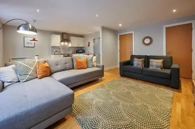 a living room with two couches and a rug at Host & Stay - Ropewalks Abode in Liverpool