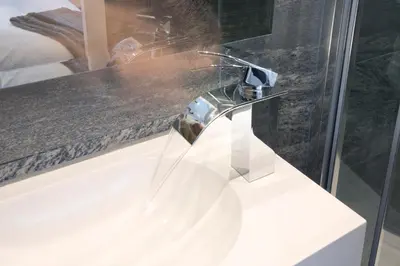 a bathroom sink with a faucet on a counter at Blackbird Luxury Apartments Room 4 in Blackpool