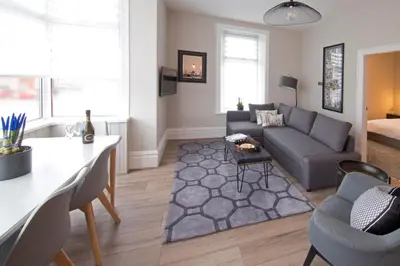 a living room with a couch and a table at Blackbird Luxury Apartments Room 3 in Blackpool