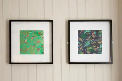 two framed pictures of birds on a wall at Blackbird Luxury Apartments Room 2 in Blackpool